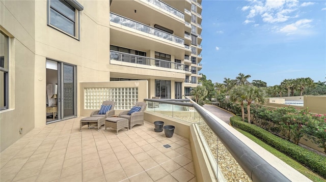 view of patio featuring a balcony