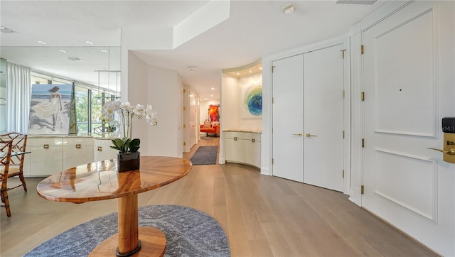 entryway with wood-type flooring