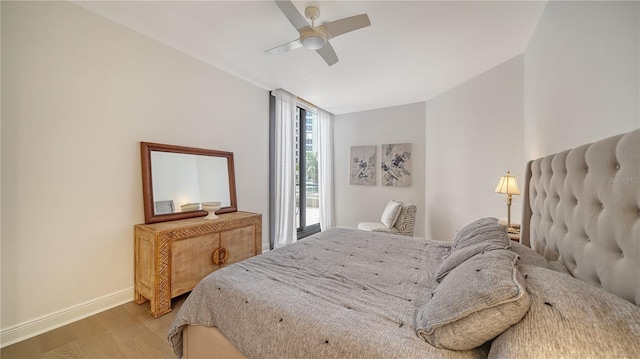 bedroom with ceiling fan and light wood-type flooring