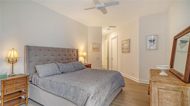 bedroom with ceiling fan and light hardwood / wood-style floors