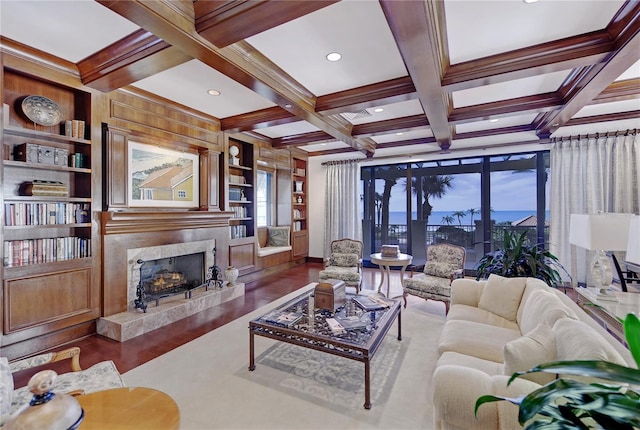 living room featuring built in shelves, beamed ceiling, wooden walls, and coffered ceiling