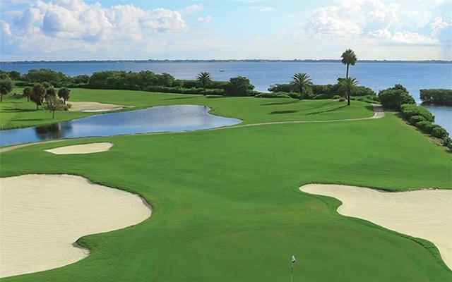 surrounding community featuring a water view