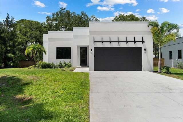 contemporary house with a front yard and a garage