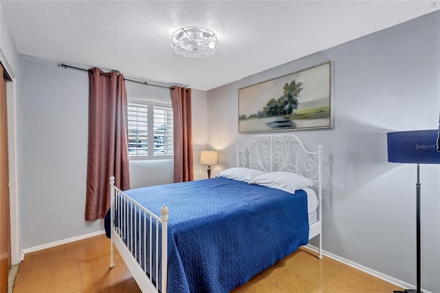 bedroom featuring a textured ceiling