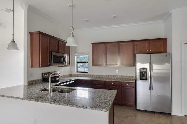 kitchen featuring appliances with stainless steel finishes, decorative light fixtures, sink, and kitchen peninsula