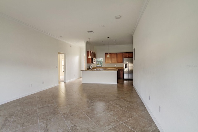 unfurnished living room with sink, tile floors, and crown molding