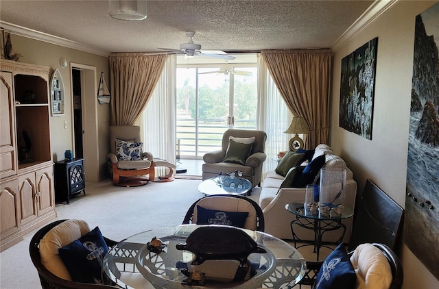 carpeted living room with crown molding, ceiling fan, and a textured ceiling