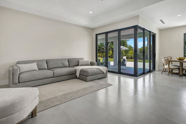 tiled living room featuring french doors