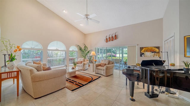 living room with high vaulted ceiling, ceiling fan, and light tile floors