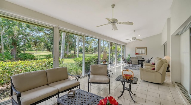 sunroom / solarium featuring lofted ceiling and ceiling fan