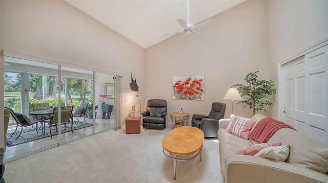 living room featuring high vaulted ceiling, ceiling fan, and carpet flooring