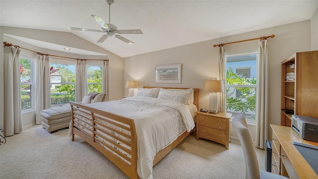 bedroom with light carpet, a textured ceiling, lofted ceiling, and ceiling fan