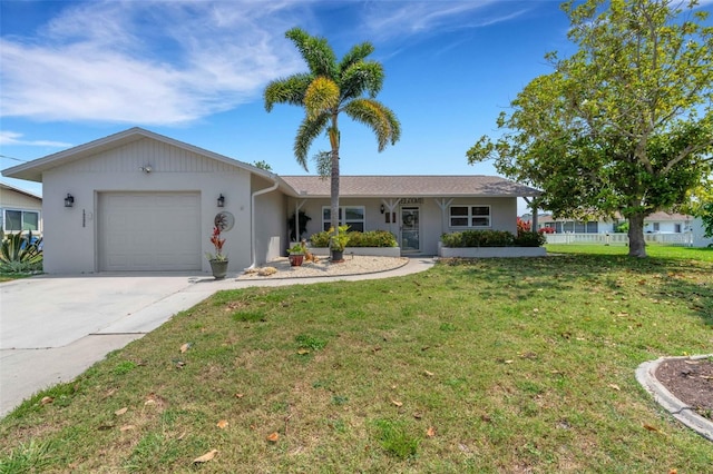 ranch-style home with a garage and a front lawn