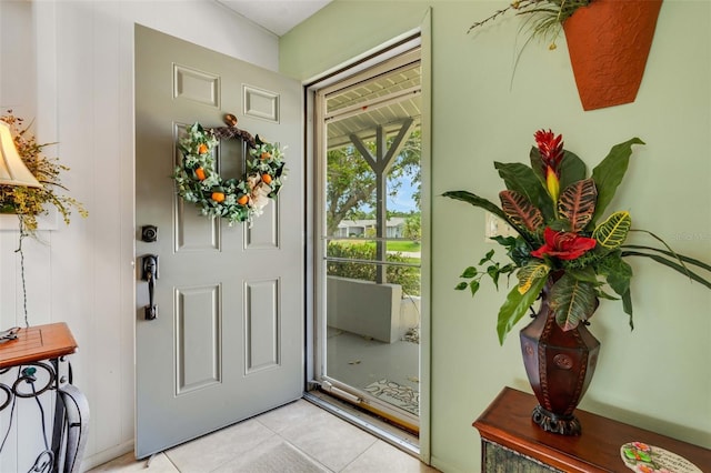 foyer entrance with light tile floors