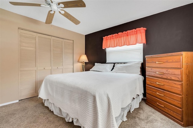 bedroom featuring carpet, ceiling fan, and a closet