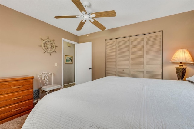 bedroom with a closet, ceiling fan, and carpet floors