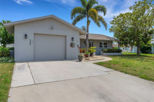 ranch-style house featuring a garage and a front lawn