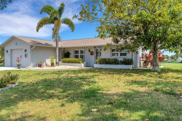 single story home featuring a garage and a front yard