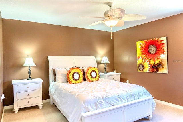 bedroom with light colored carpet and ceiling fan