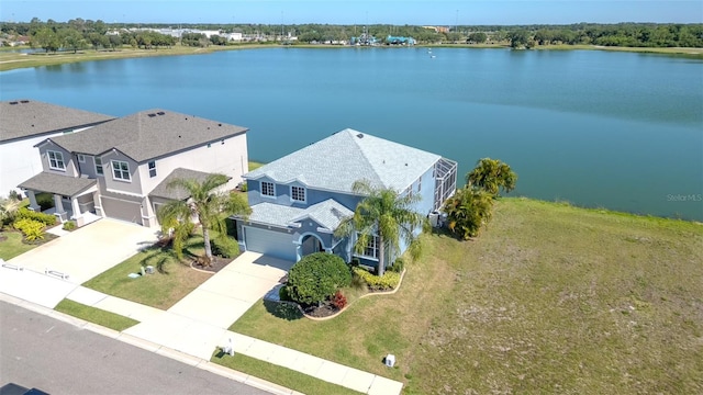 birds eye view of property with a water view