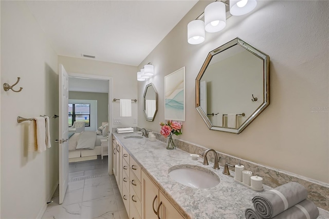 bathroom with dual bowl vanity and tile flooring