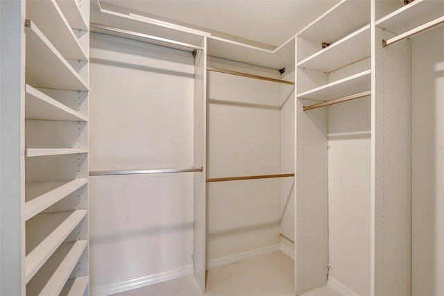 spacious closet with tile floors