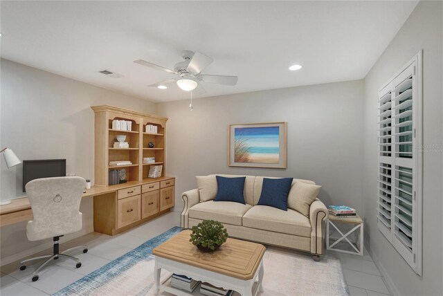 tiled living room with ceiling fan