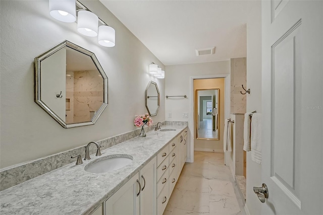 bathroom with tile floors and dual vanity