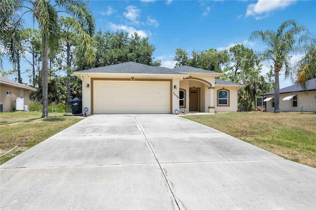 ranch-style home featuring a garage and a front yard