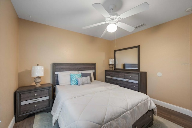 bedroom featuring ceiling fan and dark hardwood / wood-style flooring