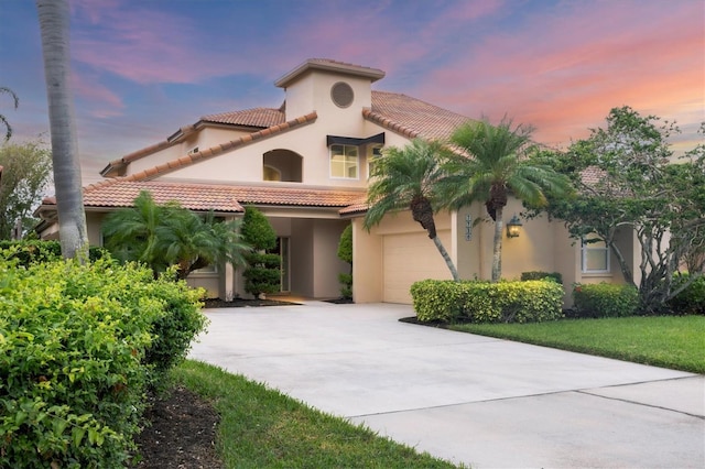 mediterranean / spanish-style home featuring a garage