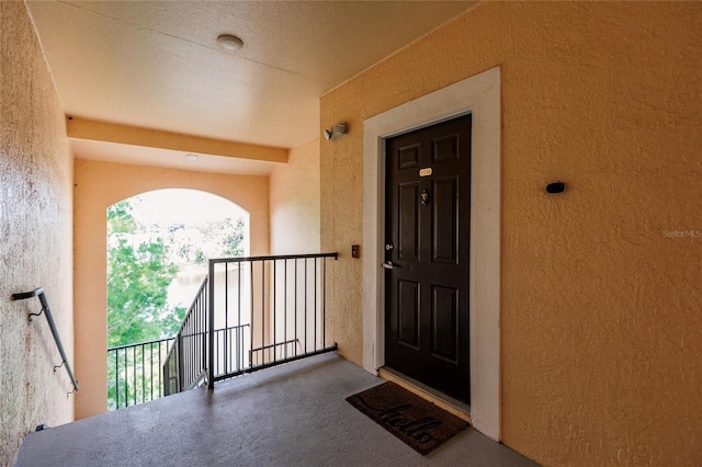 entrance to property featuring a balcony