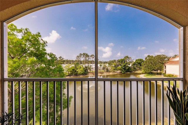 balcony featuring a water view