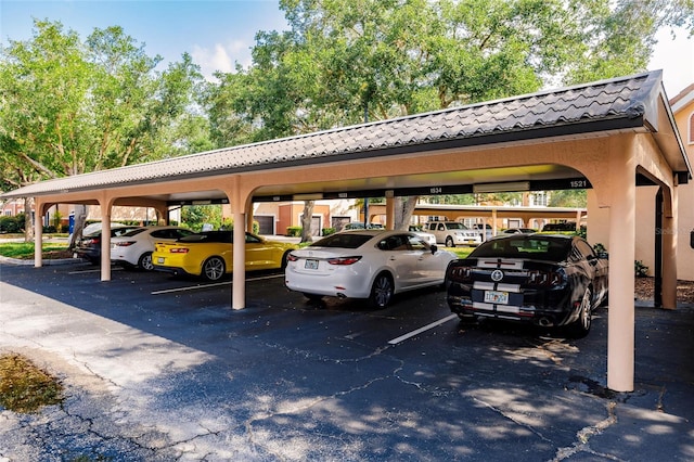 view of parking / parking lot featuring a carport