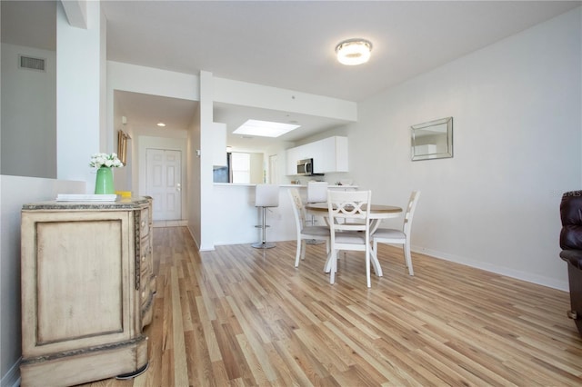 dining room featuring light hardwood / wood-style floors