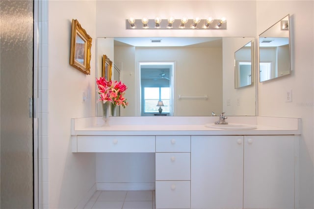 bathroom with tile patterned flooring, vanity, and an enclosed shower