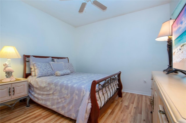 bedroom with ceiling fan and light hardwood / wood-style floors