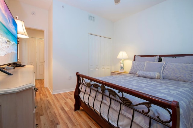 bedroom with a closet and light wood-type flooring