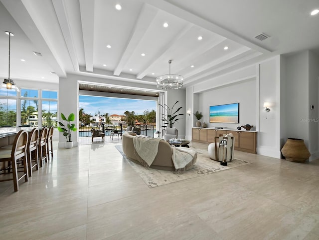 living room with recessed lighting, a chandelier, and plenty of natural light