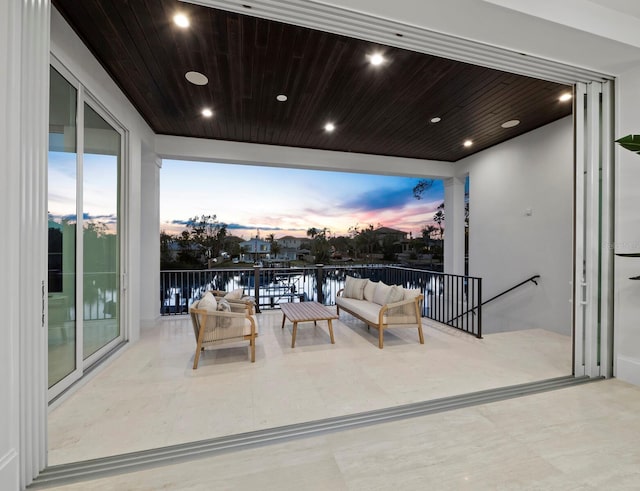 view of patio / terrace with a balcony and an outdoor hangout area