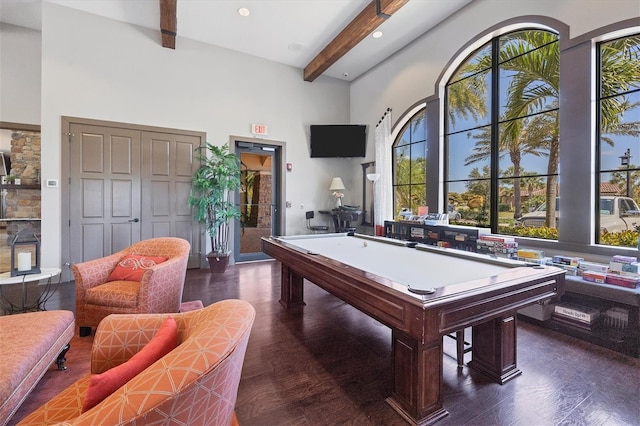 playroom featuring a high ceiling, billiards, beam ceiling, and dark hardwood / wood-style floors