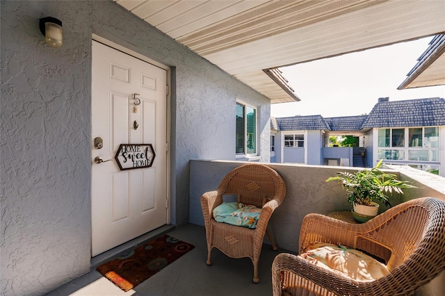 doorway to property featuring a balcony