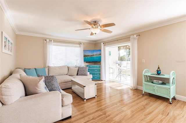 living room featuring ceiling fan, crown molding, and hardwood / wood-style flooring