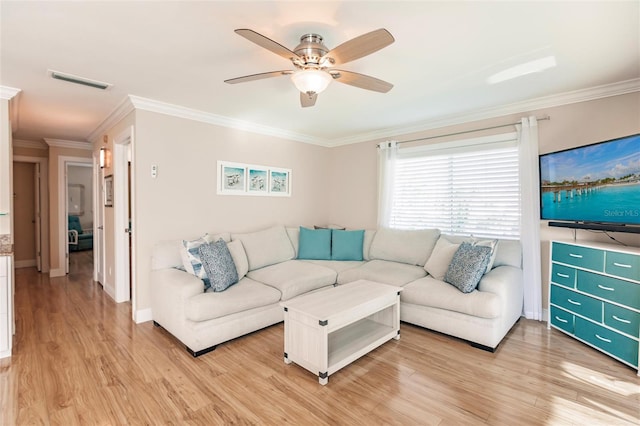 living room featuring ceiling fan, light hardwood / wood-style flooring, and ornamental molding