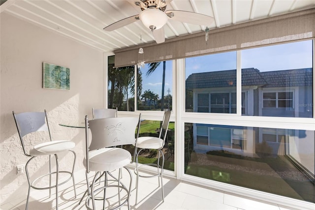 sunroom / solarium with ceiling fan