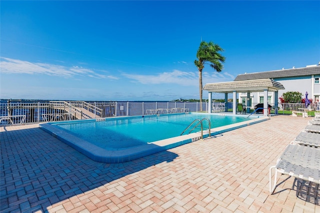 view of swimming pool featuring a pergola and a patio area