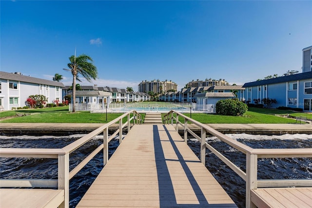 dock area featuring a lawn