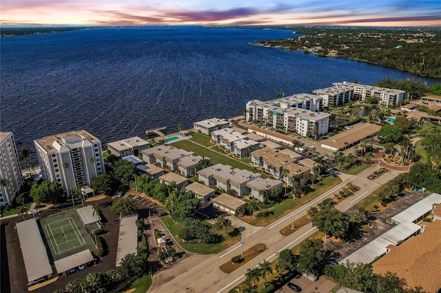 aerial view at dusk with a water view