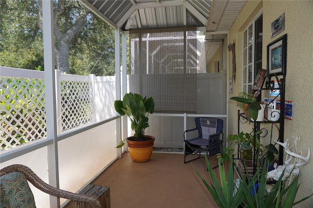 sunroom / solarium with a wealth of natural light and vaulted ceiling