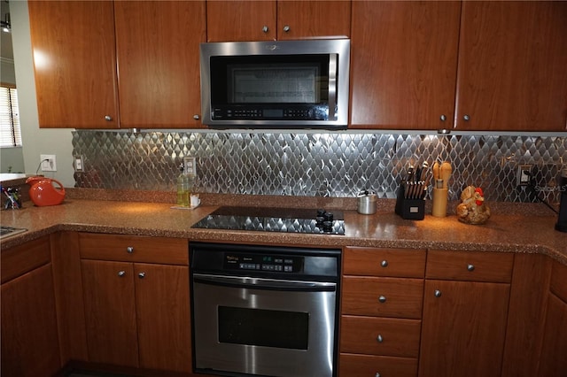 kitchen featuring backsplash and stainless steel appliances